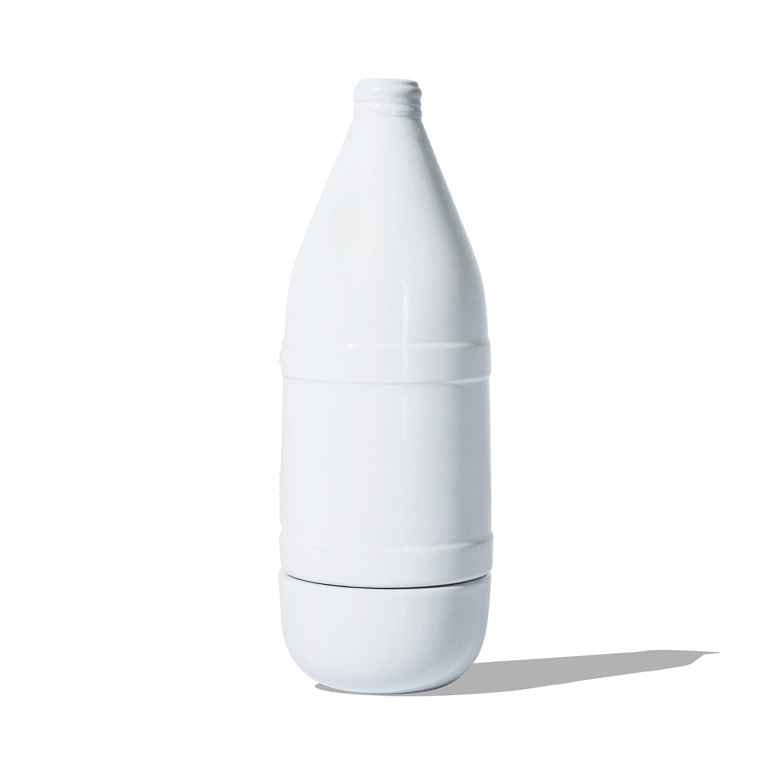 Back view of ceramic bottle-shaped incense burner with logo detailing