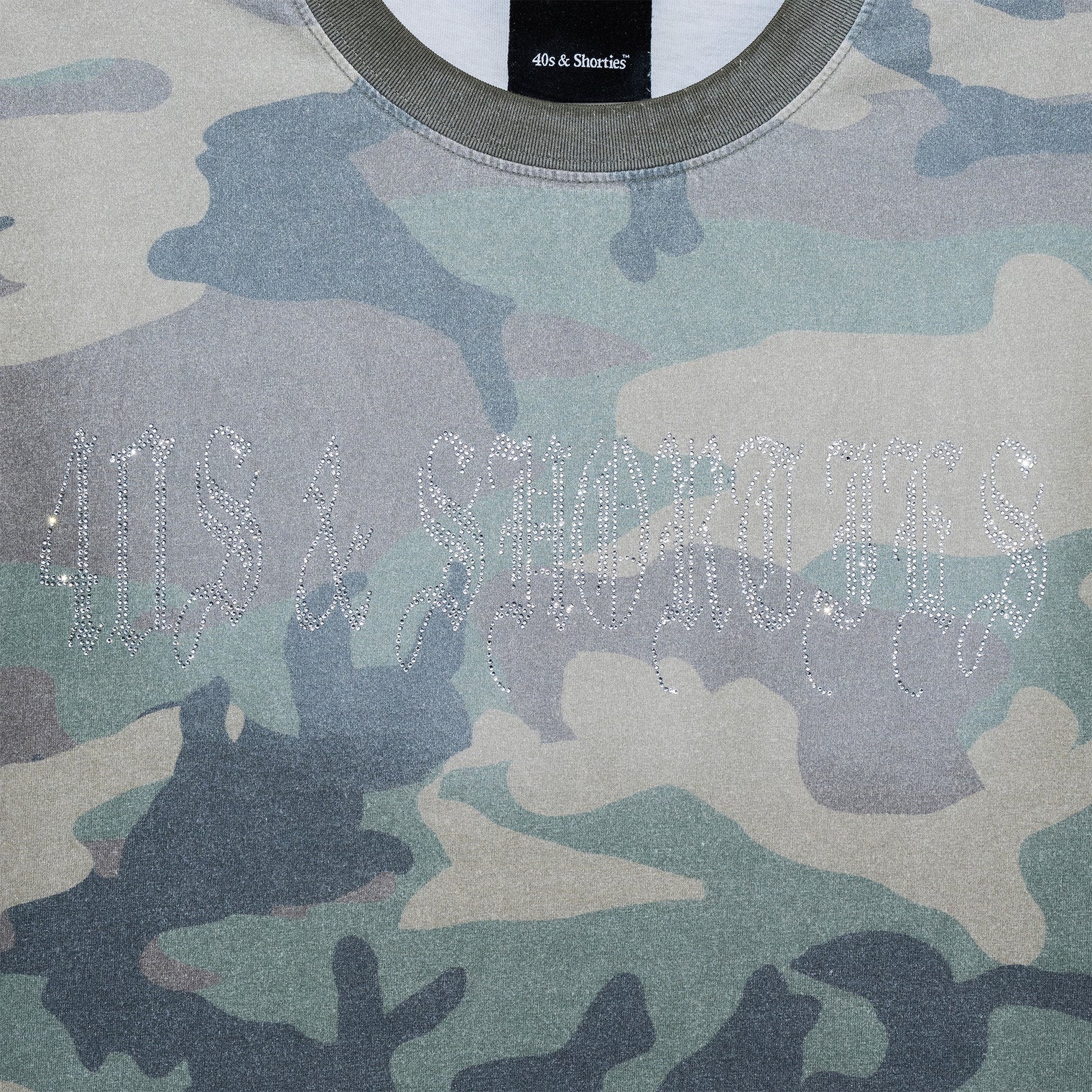 Close-up of rhinestone 40s & Shorties logo on chest of Angel Wings Tee in Camo