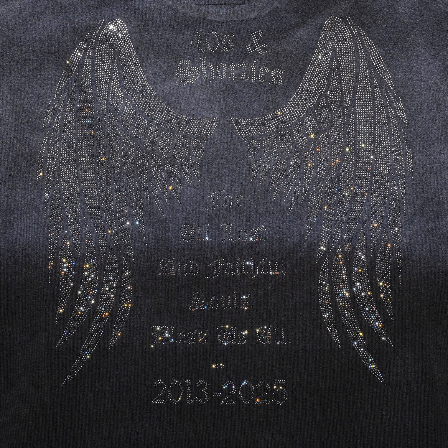 Detail view of rhinestone angel wings and tribute message on back of Angel Wings Tee in Charcoal