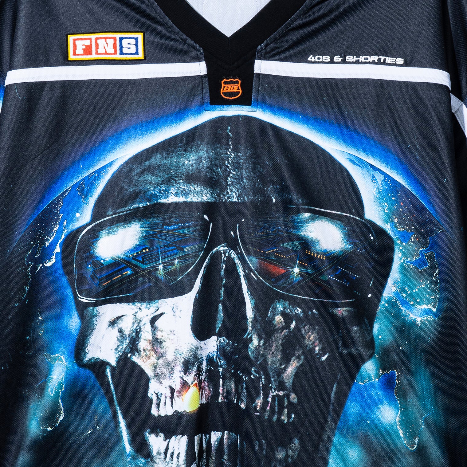 Close-up of skull artwork on the Tales Hockey Jersey chest with glowing eyes and space-inspired details.