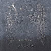Detail view of rhinestone angel wings and tribute message on back of Angel Wings Tee in Charcoal