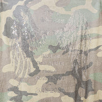Detail view of rhinestone angel wings and tribute message on back of Angel Wings Tee in Camo