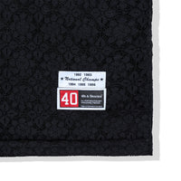 Woven label detail near hem of the Crochet Football Jersey