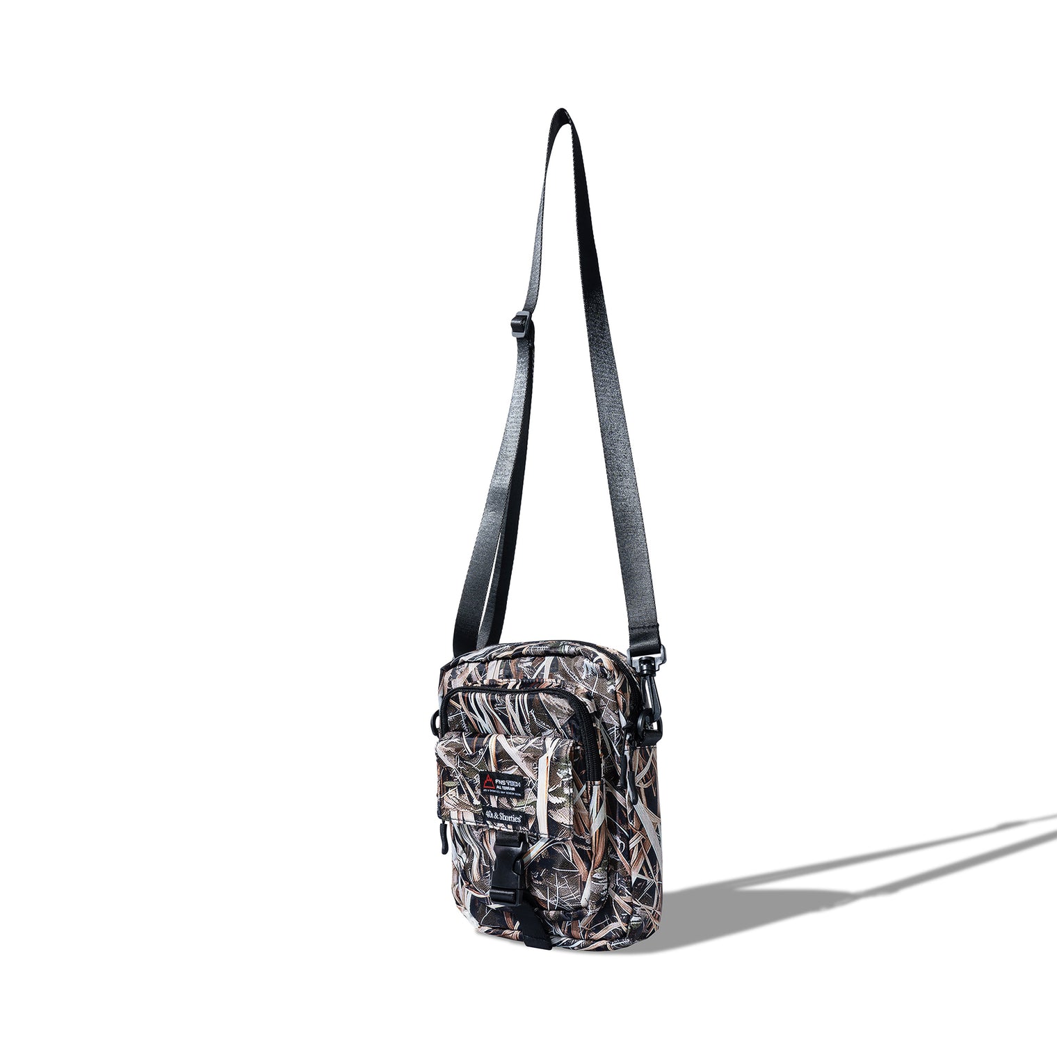 Angled side view of the Reed Camo Side Bag showcasing zipper and strap