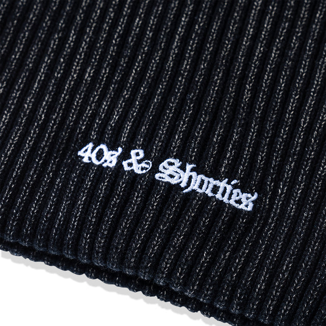 Close-up of white embroidered 40s & Shorties logo on ribbed acrylic knit of OG Text Beanie – Multi