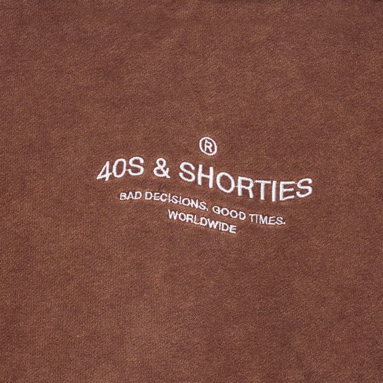 Wavy General Logo Hoodie Coyote – Close-up of front embroidery