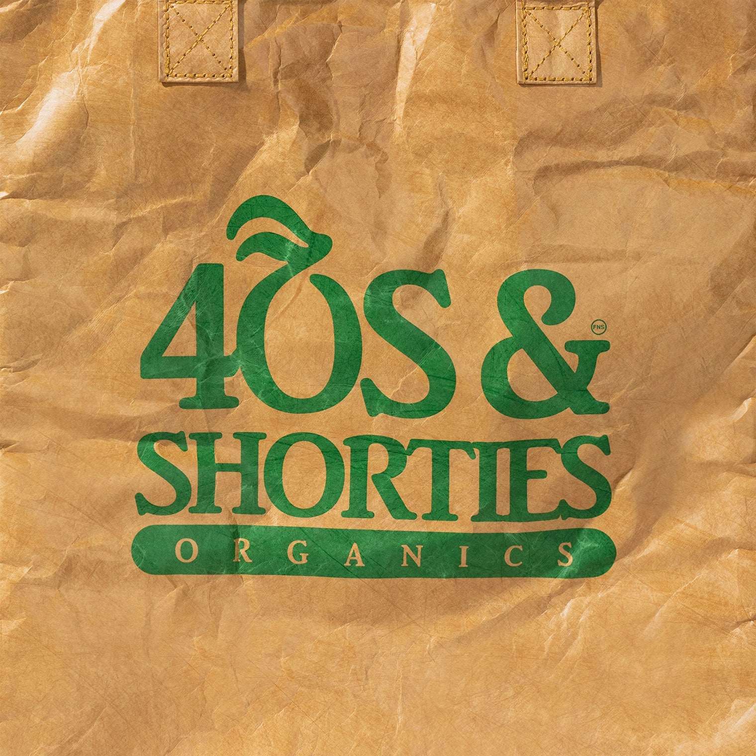 Close-up of 40s & Shorties Organics logo in green on kraft paper