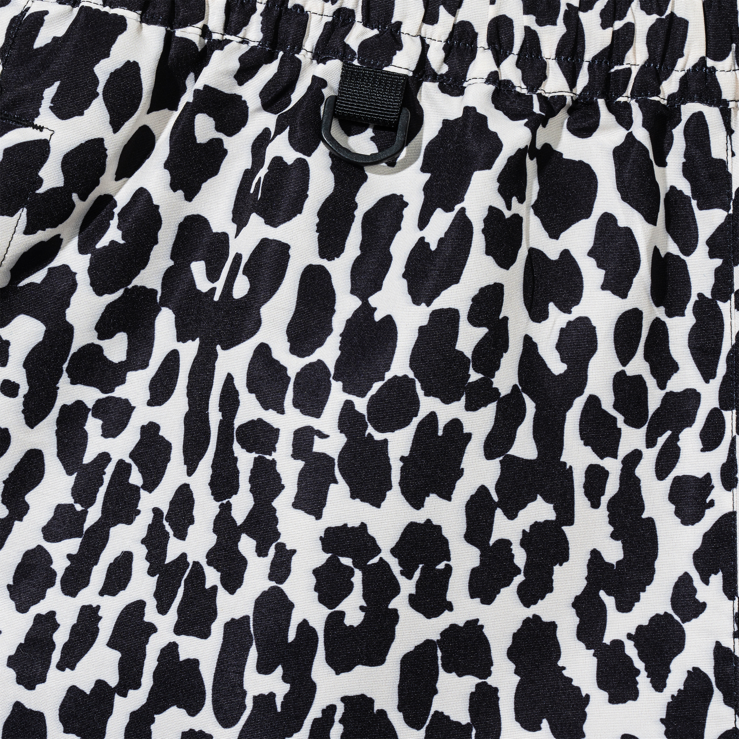 Close-up of elastic waistband with black D-ring on Desert Leopard Shorts
