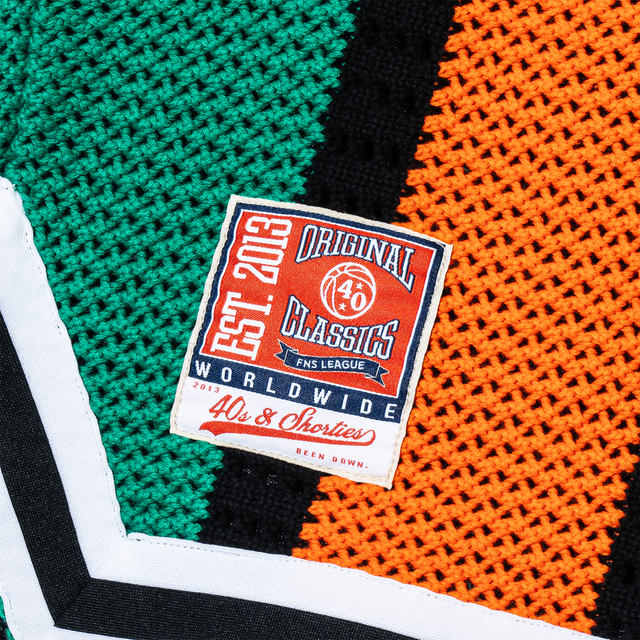 Detailed view of woven “Original Classics – EST. 2013 – 40s & Shorties” patch on lower leg of Beachside Basketball Shorts.