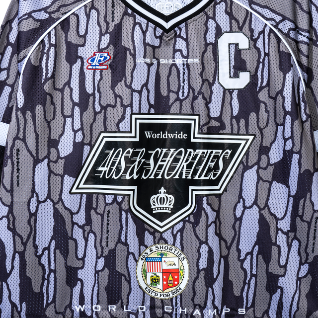 Close-up of 40s & Shorties front chest logo on Champs Hockey Jersey – Camo