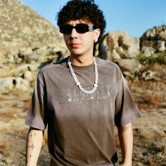 Model wearing 40s & Shorties Angel Wings Tee in black with rhinestone script logo across chest.