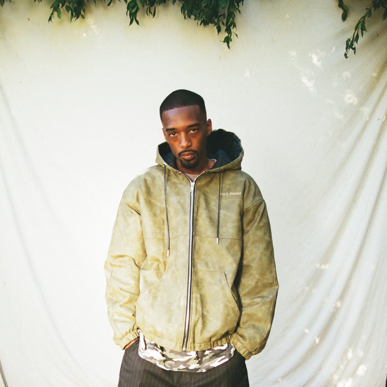 Model front view wearing Damien Zip Hoodie – Brown