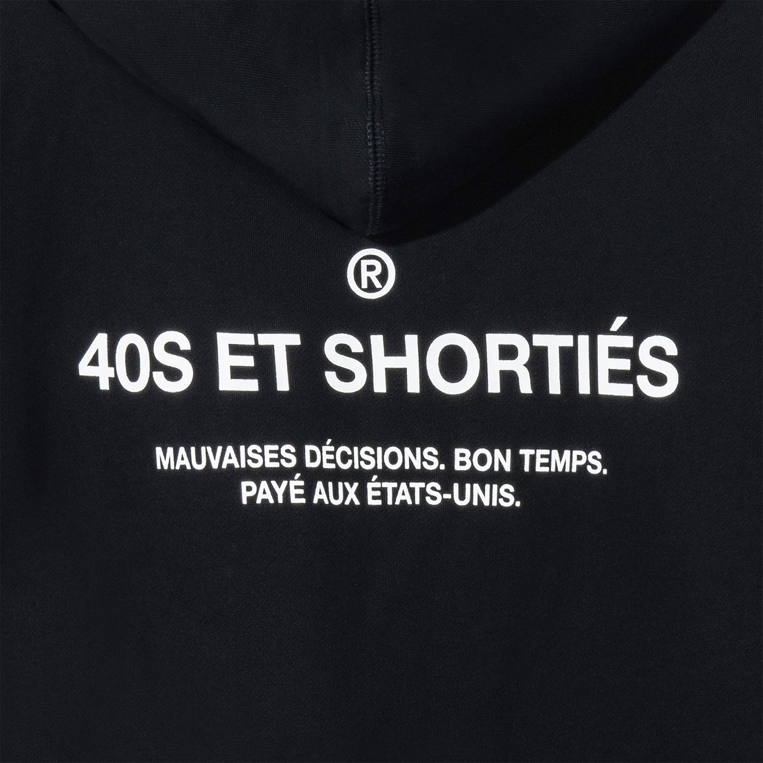 Detailed view of printed “40S ET SHORTIÉS” graphic with French text on back of black hoodie – 40s & Shorties.