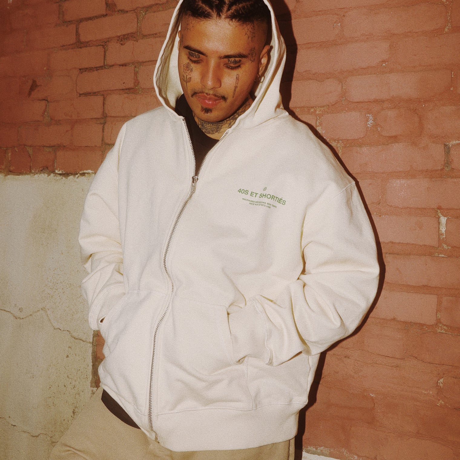Male model wearing French General Zip Hoodie in cream – 40s & Shorties.