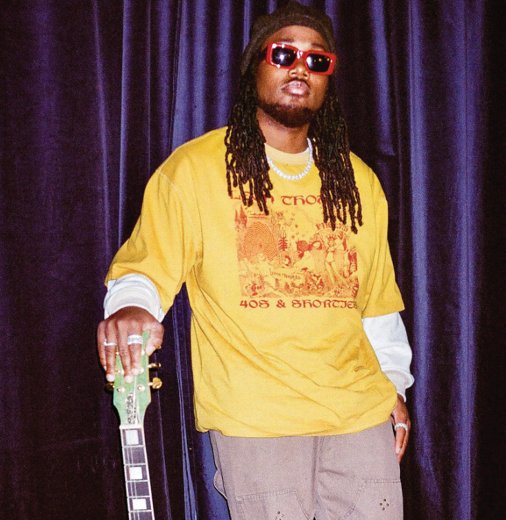 Full-body shot of model in Trippy Tee sand beige featuring bold front graphic