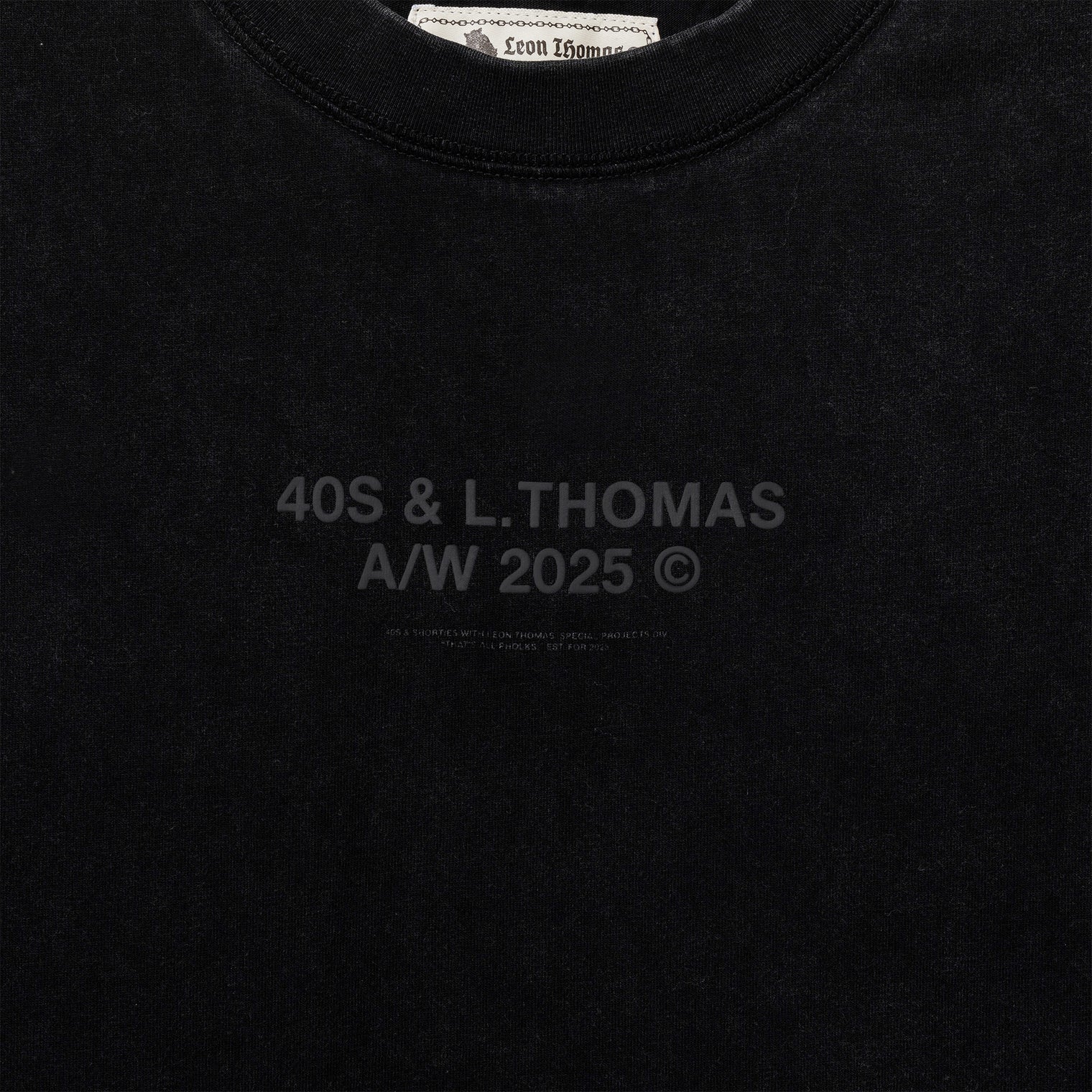 Close-up of Leon General Logo Tee showing subtle puff print collaboration graphic