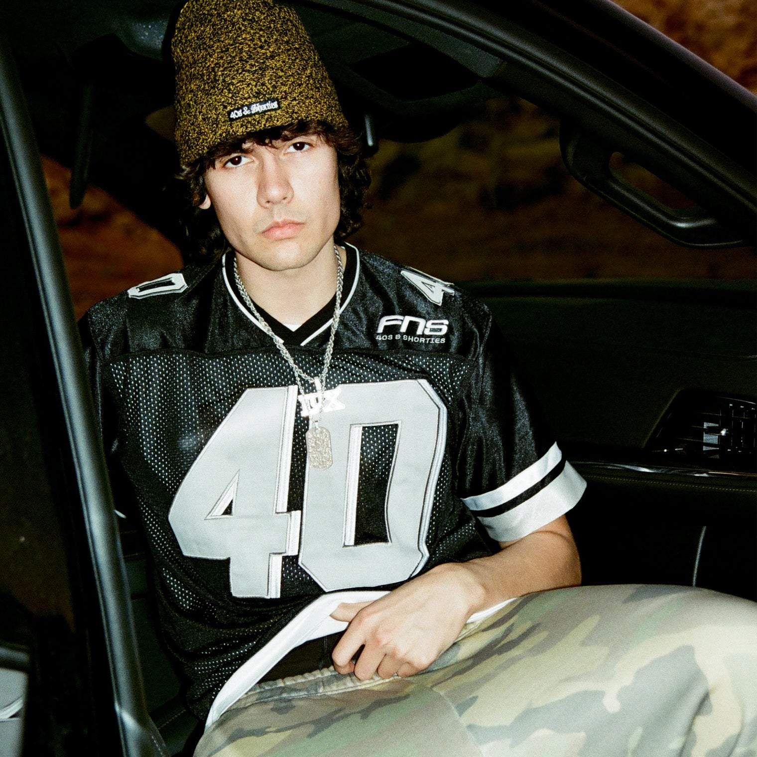Male model wearing the Fubar Jersey in Black, showing front appliqué.