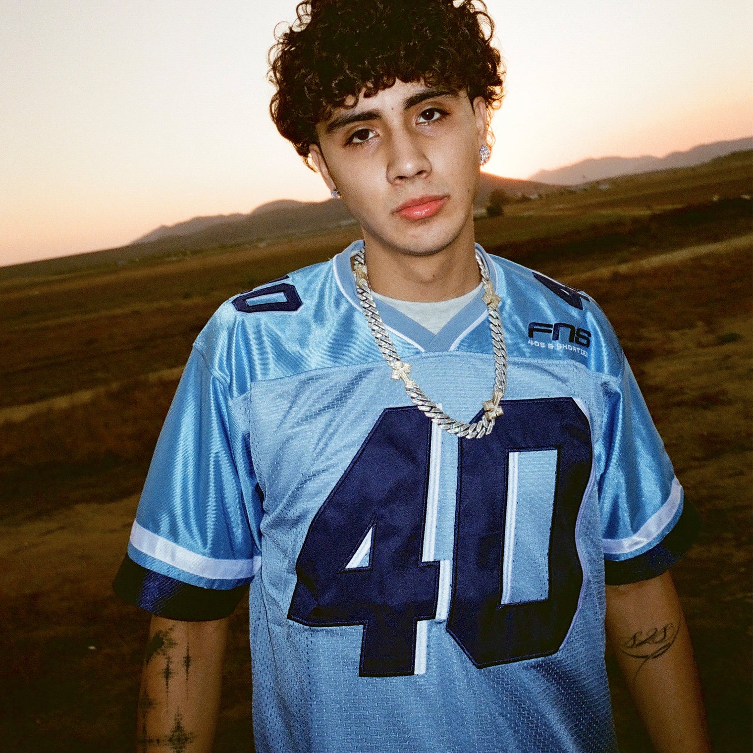 Male model wearing the Fubar Jersey in Blue, showing front appliqué.