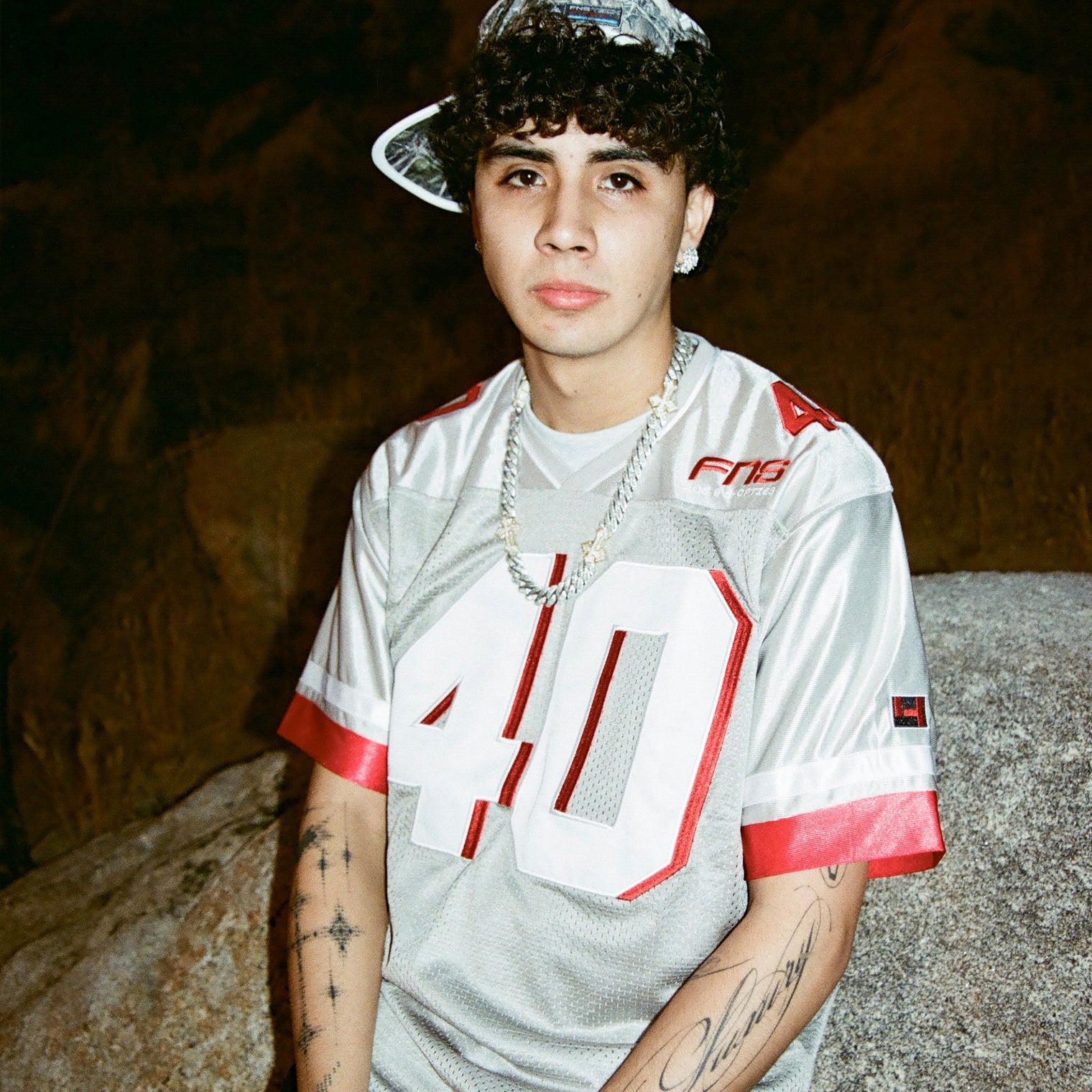 Angled close-up of model in the Fubar Jersey Grey, emphasizing mesh texture and chest embroidery.