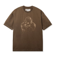 Front view of PHOLKS Tee in washed brown with tonal Leon Thomas graphic

