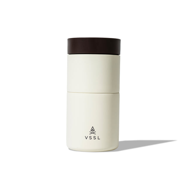 The assembled Coffee Pour Over Set featuring the VSSL logo on the front of the matte cream exterior with brown lid.