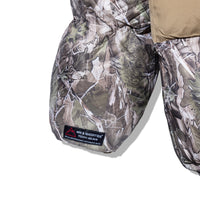 Detail of Faded Camo Puffer Jacket – zippered pocket and tech gear label