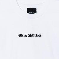Close-up of chest print on Wake & Brew Tee White – 40s & Shorties tribal-style logo.
