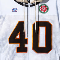Close-up of Jackson Jersey Sweater Desert Camo – applique 40 number and embroidered chest patches
