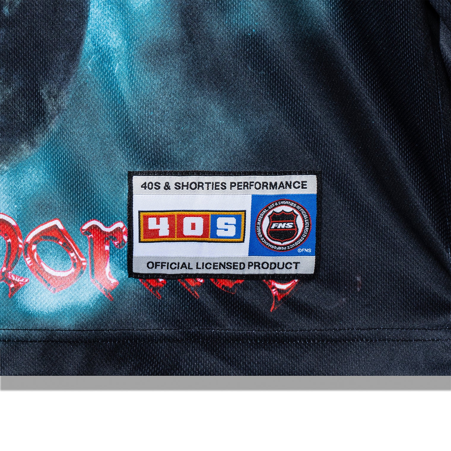 Hem patch detail on the Tales Hockey Jersey showing 40s & Shorties branding and official licensed product label.