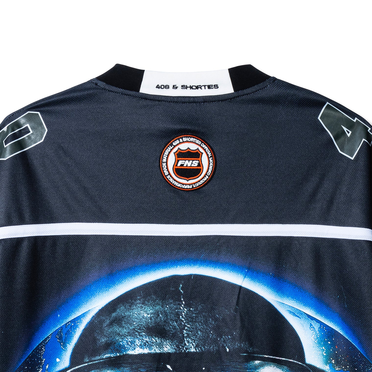 Close-up of back neck patch on the Tales Hockey Jersey with FNS circle emblem and 40s & Shorties branding.