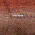 Close-up of 40s & Shorties embroidery on front pocket of the Lithium Cardigan
