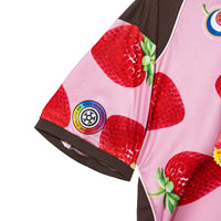 Detail of the sleeve featuring fruit-themed prints and heat transfer graphics
