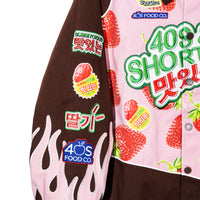Right sleeve of the Gummy Race Jacket showcasing flame embroidery and strawberry patch details