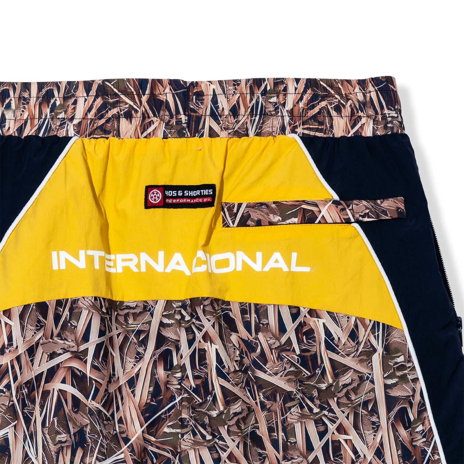 Close-up of yellow back panel with "Internacional" text and 40s & Shorties woven label