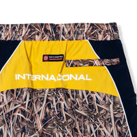 Close-up of yellow back panel with "Internacional" text and 40s & Shorties woven label