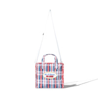 Back view of the Mini Laundry Bag in multi-color plaid with matching top handles and shoulder strap