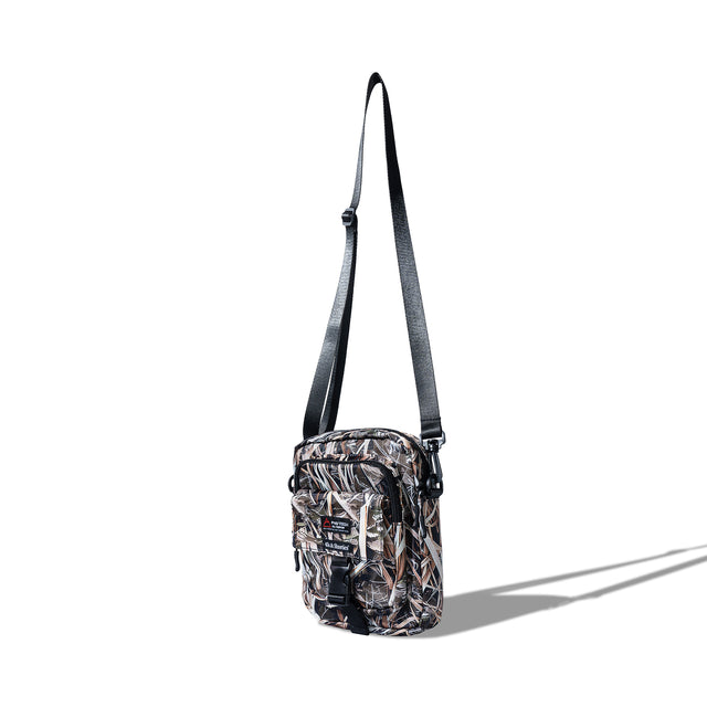 Angled side view of the Reed Camo Side Bag showcasing zipper and strap
