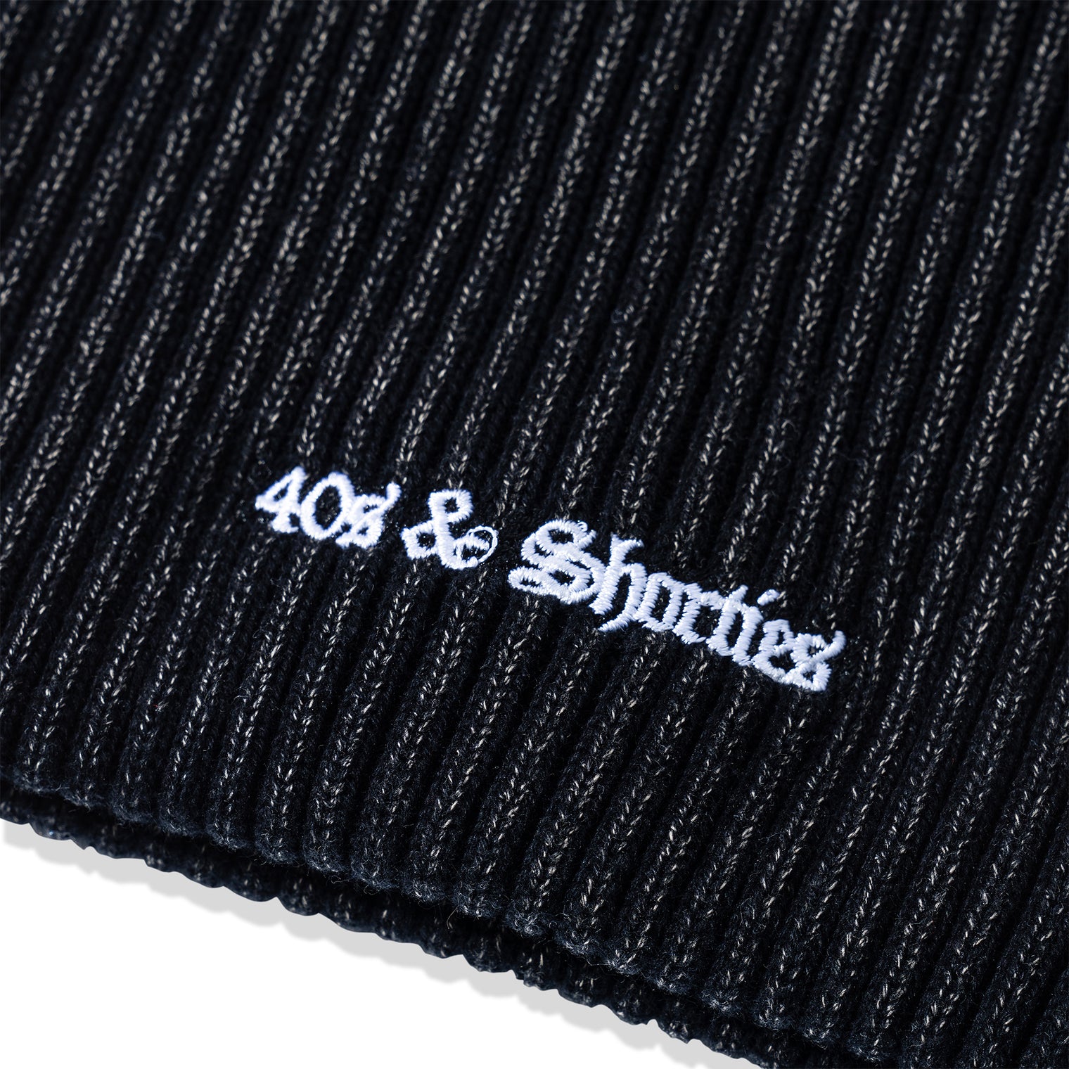 Close-up of white embroidered 40s & Shorties logo on ribbed acrylic knit of OG Text Beanie – Multi
