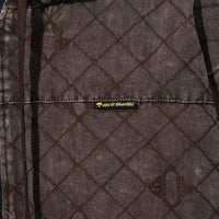 Close-up of 40s & Shorties woven label on the Foreman Hooded Jacket
