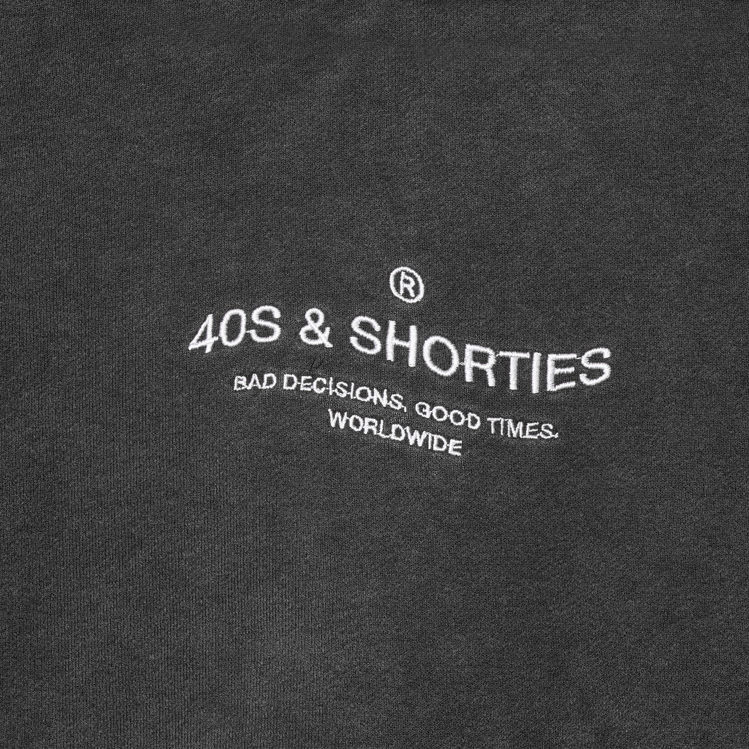 Wavy General Logo Hoodie Black – Close-up of front embroidery
