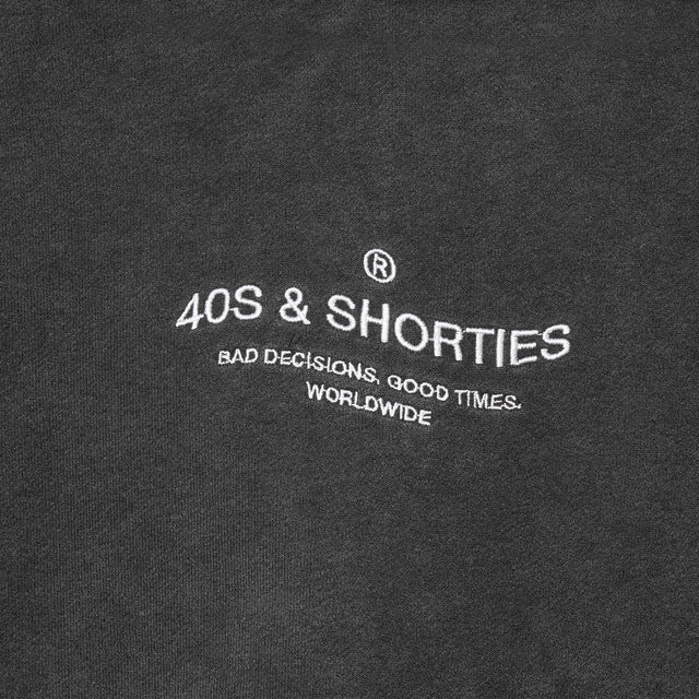 Wavy General Logo Hoodie Black – Close-up of front embroidery
