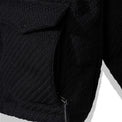 Detail of front pocket with zipper entry beneath flap