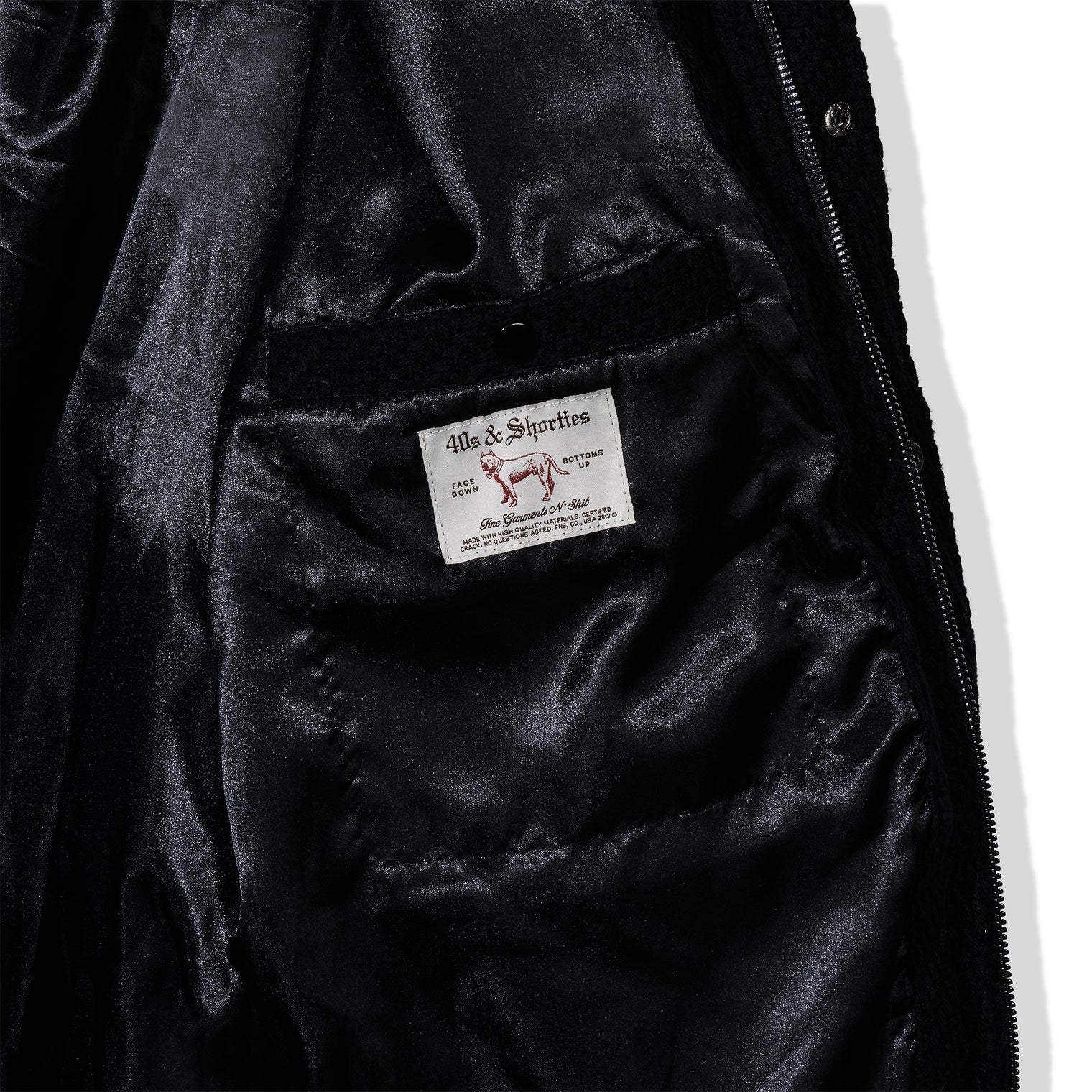 Inside view of the jacket showing satin lining and woven label