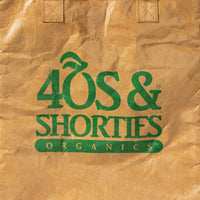 Close-up of 40s & Shorties Organics logo in green on kraft paper