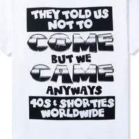 Close-up of back slogan print: "They Told Us Not To Come But We Came Anyways" in black text.
