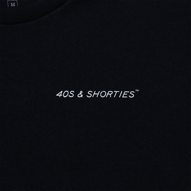 Close-up of the front chest logo reading “40s & Shorties” on black cotton.
