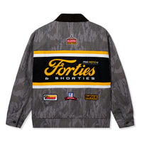 Back of Camo Garage Jacket with racing patches and printed camo design
