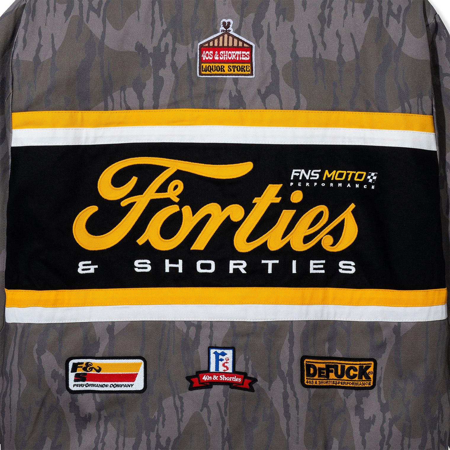 Detailed embroidery of Forties & Shorties logo on back of Camo Garage Jacket
