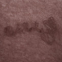 Close-up of embroidered “40s & Shorties” logo and hearts across the chest.
