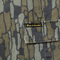 Close-up of cargo pocket with yellow 40s & Shorties woven label
